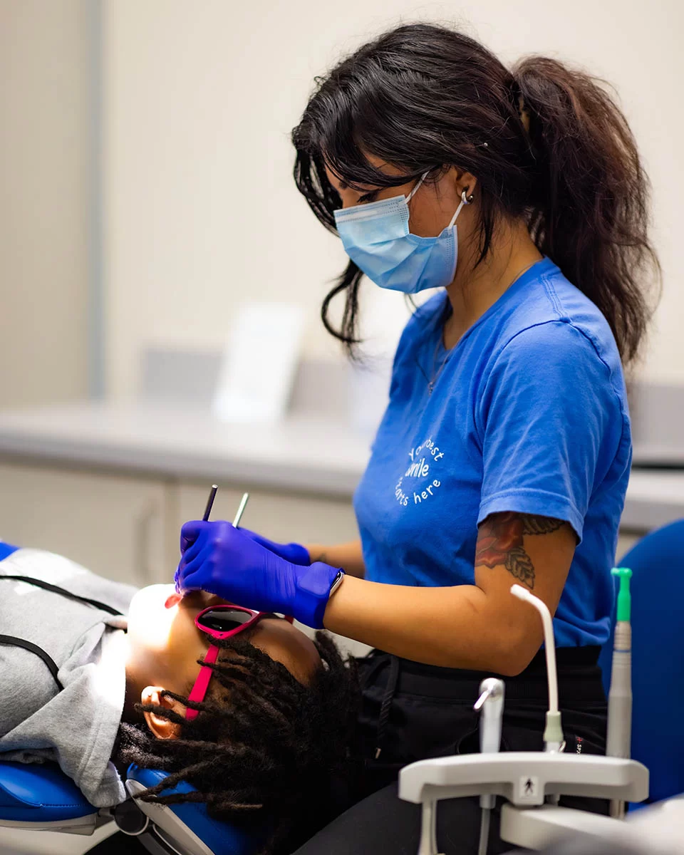 Hygienist working with patient